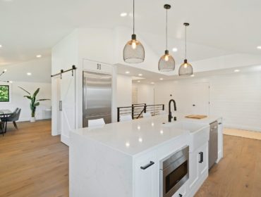 turned on pendant lamps above kitchen island